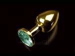 Маленькая золотистая анальная пробка с круглым кончиком и изумрудным кристаллом - 7 см. #56268