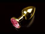 Маленькая золотистая анальная пробка с круглым кончиком и рубиновым кристаллом - 7 см. #56272
