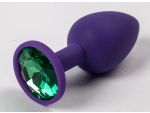 Фиолетовая силиконовая анальная пробка с зеленым стразом - 7,1 см. #52292